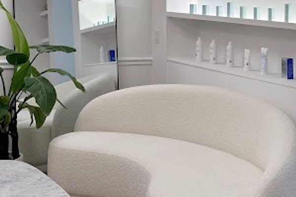 Clean, professional medical spa treatment room with neutral tones at Aesthé by MD in Stamford