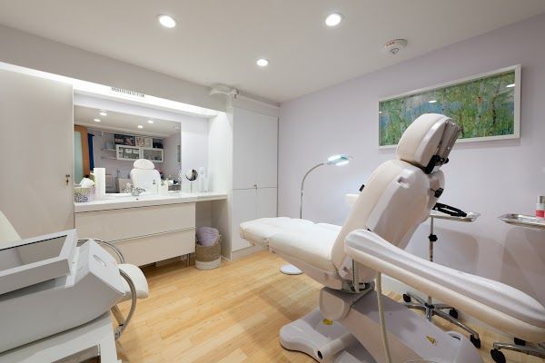 Clean, professional medical spa treatment room with neutral tones at Age Perfectly in Newton