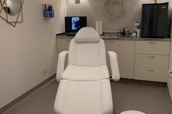 Clean, professional medical spa treatment room with neutral tones at Chicque Aesthetics in Greenwich