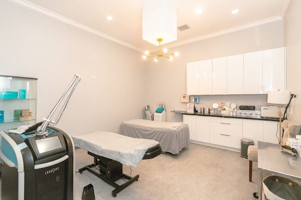 Clean, professional medical spa treatment room with neutral tones at Deluxe Cosmetic Center in Los Angeles