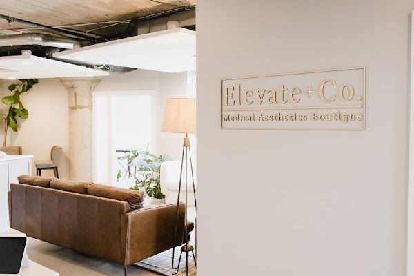 Clean, professional medical spa treatment room with neutral tones at Elevate + Co. in Milwaukee