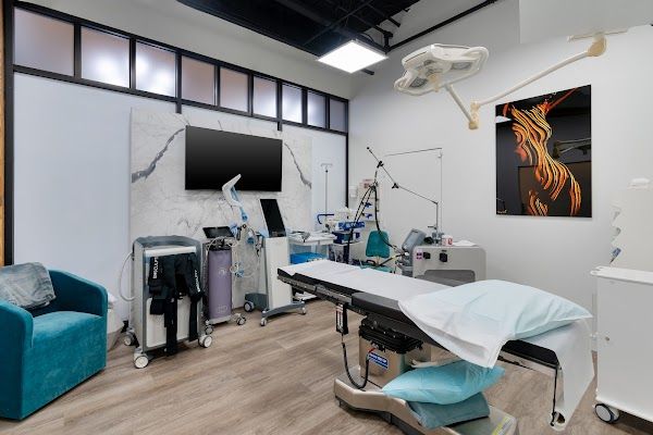 Clean, professional medical spa treatment room with neutral tones at Elysium Aesthetics + Longevity in Chicago