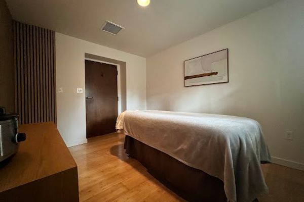 Clean, professional medical spa treatment room with neutral tones at Jinsei Spa in Bend