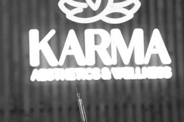 Clean, professional medical spa treatment room with neutral tones at Karma Aesthetics and Wellness in Mesa