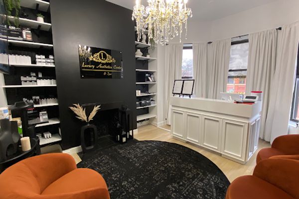 Clean, professional medical spa treatment room with neutral tones at Luxury Aesthetics Center in Boston