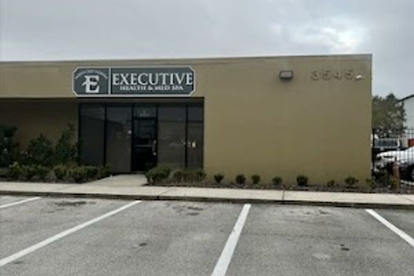 Clean, professional medical spa treatment room with neutral tones at Northeast Florida Executive Health and Med Spa in Jacksonville