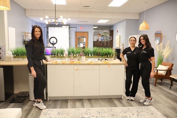 Clean, professional medical spa treatment room with neutral tones at Origin Wellness Co in Manchester