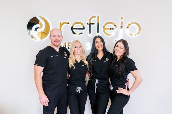 Clean, professional medical spa treatment room with neutral tones at Reflejo Med Spa in Phoenix
