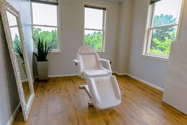 Clean, professional medical spa treatment room with neutral tones at Renew Me Medspa of Arlington in Arlington
