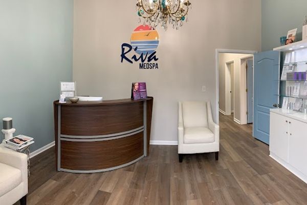 Clean, professional medical spa treatment room with neutral tones at Riva MEDSPA in Virginia Beach