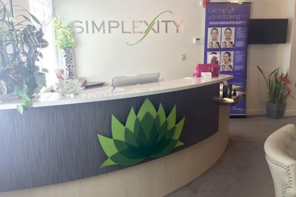 Clean, professional medical spa treatment room with neutral tones at Simplexity Medical Aesthetics in Ogden