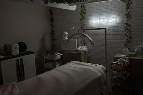 Clean, professional medical spa treatment room with neutral tones at Skin Alchemy in Charleston