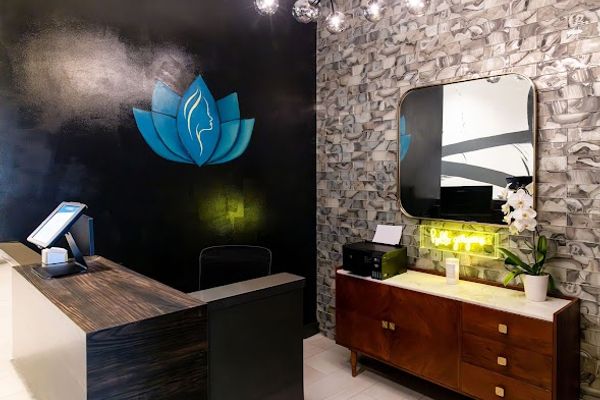 Clean, professional medical spa treatment room with neutral tones at Timeless Med at The Refuge in Jackson