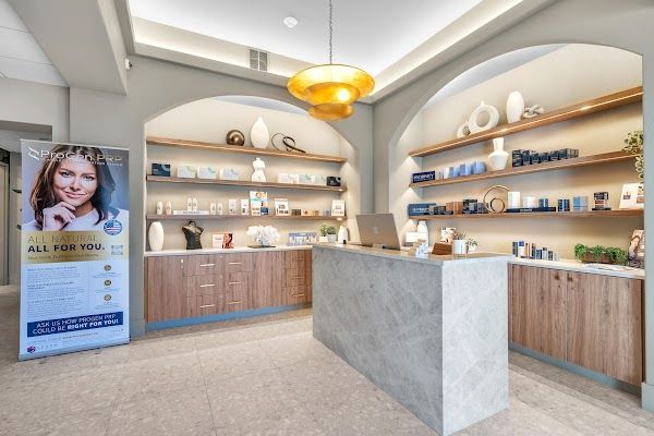 Clean, professional medical spa treatment room with neutral tones at Viva Med Spa & Wellness in Providence