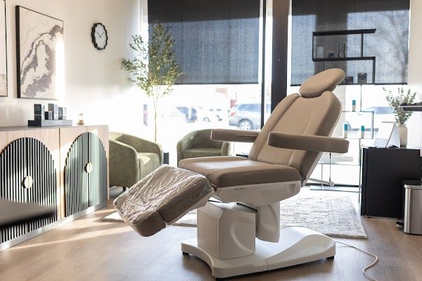 Clean, professional medical spa treatment room with neutral tones at Wave Aesthetics in Wilmington